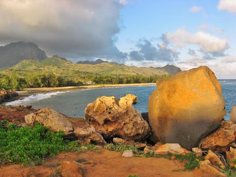 View of Boulders on Cliff's Edge at Gillin's Beach and Ezra's Beach from the end of Maha'ulepu Heritage Trail near Punahoa Point on Island of Kauai on Hawaii. High quality photo.