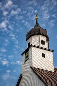 A beautiful clock tower, traditional in Germany. Vertical view