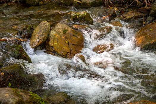 Scenic view of amazing water stream between rocks. Close up