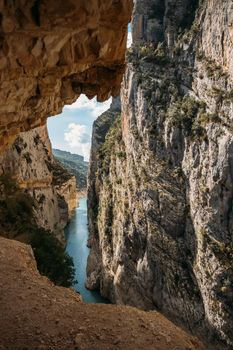 A path excavated in the rock allows to cross Congost de Mont-Rebei defile, Famous hiking trail in Spain.