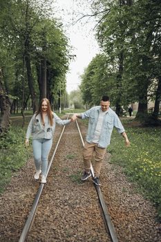 loving couple walking in ukrainian park and city