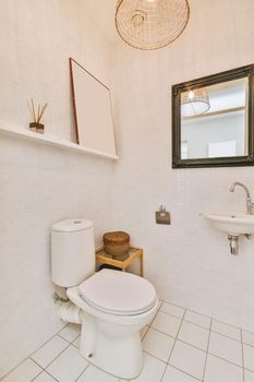 Interior of small clean restroom in miniature style