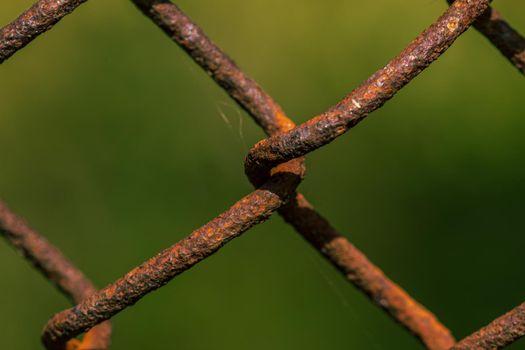 Rusted metal fence weave close up