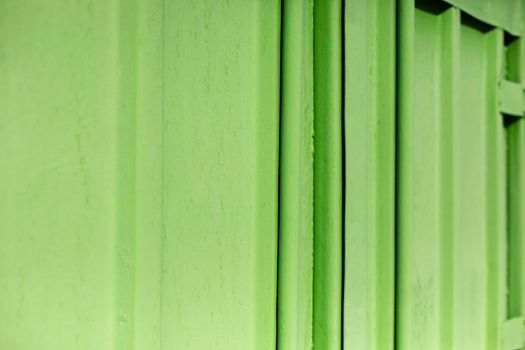 Texture of steel fence. Wall of building. Bright colors in architecture. Reflective surface.