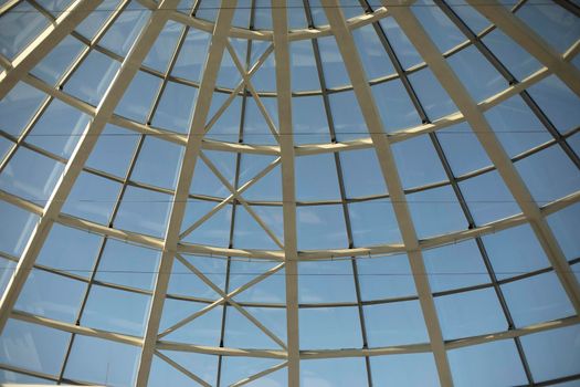 Dome is made of glass. Architecture details. Roof is in shape of sphere. Glazing in building.