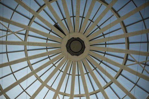 Dome of shopping center. Ceiling in building. Skylight. Architecture details.