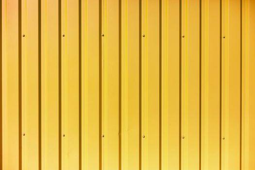 Texture of steel fence. Wall of building. Bright colors in architecture. Reflective surface.