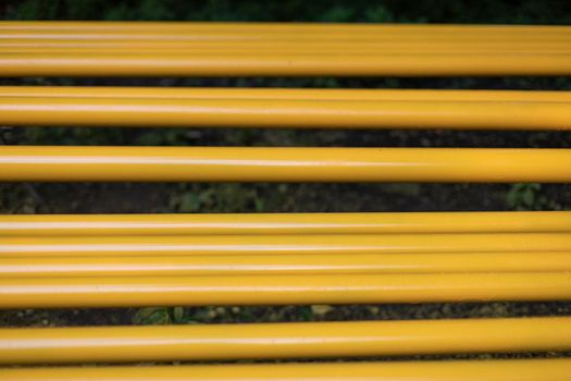 Yellow pipes. Gas pipes lie in row. Preparation of equipment replacement. Details of construction of communications.