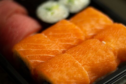 Sushi with salmon. Asian cuisine. Seafood from the restaurant. Delicious food at home.