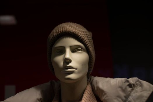 Mannequin in hat. Headdress on head. Stylish clothes. Fashion today. Mannequin in store.