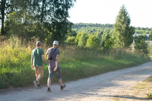 People in the village. Rest at a folk festival in Russia. The villagers are walking in nature. Rest on earth.