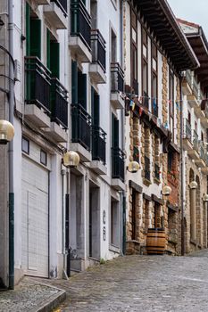 Street with houses and architecture of Basque Country, Spain.