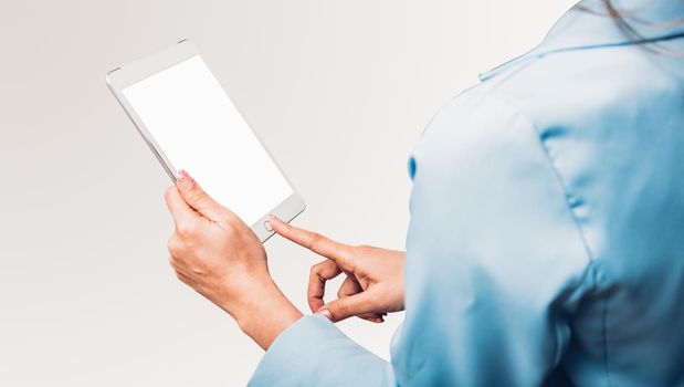 Young business woman using her finger touch on blank screen display computer tablet technology studio shot isolate on white background