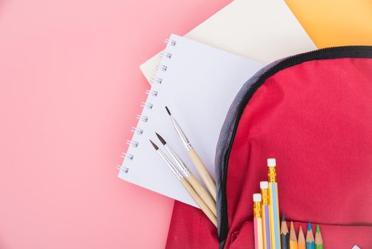 Top view flat lay of red school bag backpack and accessories tools for children education on pink background, Back to school concept and have copy space for use