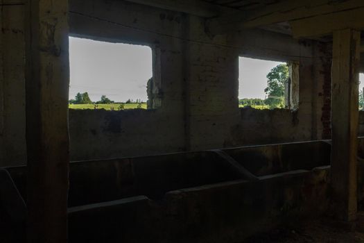 Old farm building under construction, abandoned cow cattle feeding room place
