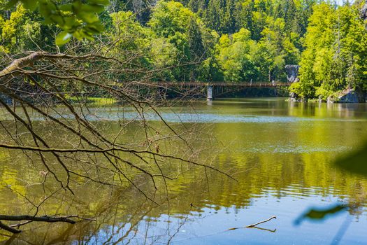 Long steel hanging footbridge over Modre lake