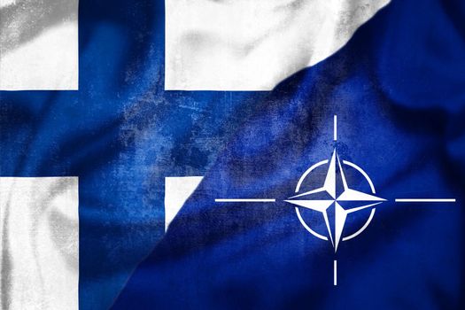 Helsinki, Finland - May 3 2022: Grunge flags of Finland and NATO illustration, concept of Finland plans to enter NATO