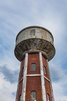 High red brick tower as part of old factory complex