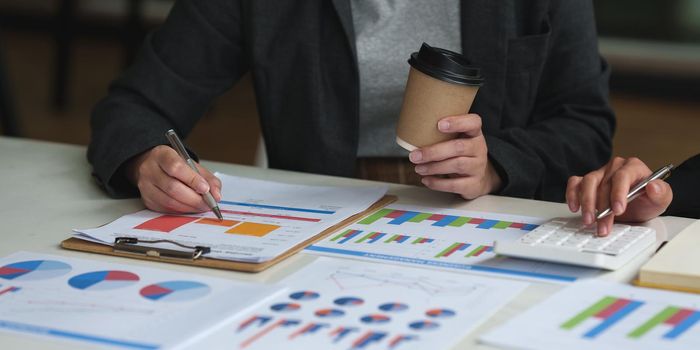 Business team hands at working with financial plan, meeting, discussion, brainstrom with tablet on office desk, Meeting concept