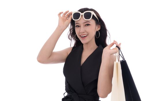 cheerful young woman holding shopping bag isolated on a white background