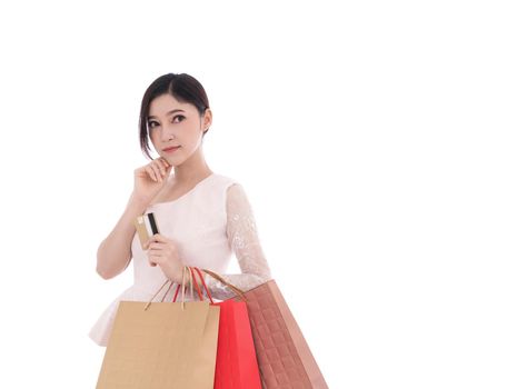 young woman thinking and holding shopping bag isolated on a white background