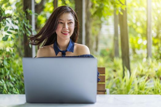 happy woman using laptop computer