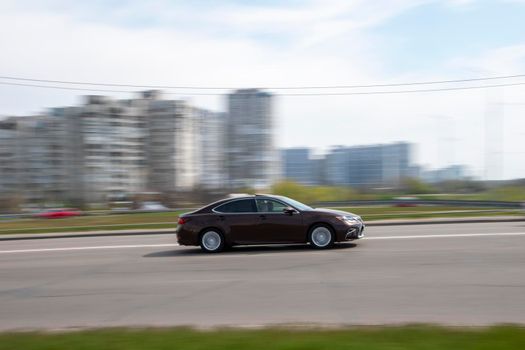 Ukraine, Kyiv - 20 April 2021: Purple Lexus ES car moving on the street. Editorial