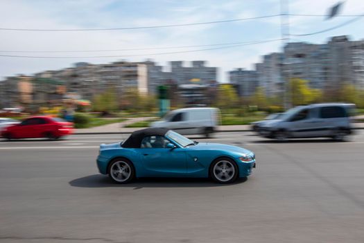 Ukraine, Kyiv - 20 April 2021: Silver Ford Econoline car moving on the street. Editorial