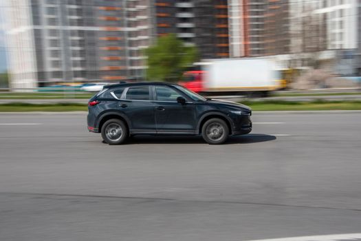 Ukraine, Kyiv - 26 April 2021: Black MAZDA CX-5 car moving on the street. Editorial