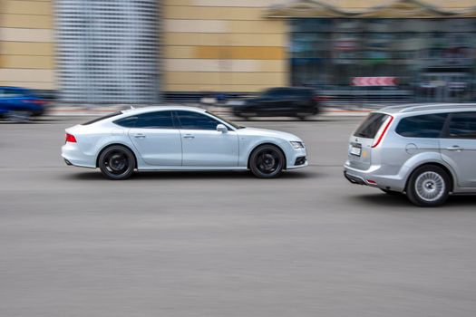 Ukraine, Kyiv - 26 April 2021: White Audi A7 car moving on the street. Editorial