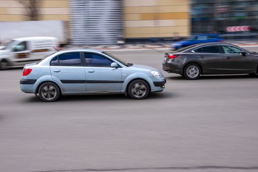 Ukraine, Kyiv - 26 April 2021: White KIA Rio car moving on the street. Editorial