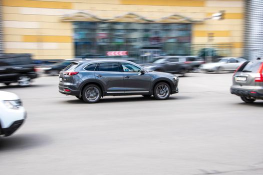 Ukraine, Kyiv - 26 April 2021: Gray MAZDA CX-9 car moving on the street. Editorial