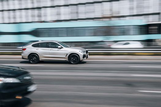 Ukraine, Kyiv - 29 April 2021: White BMW X4 car moving on the street. Editorial