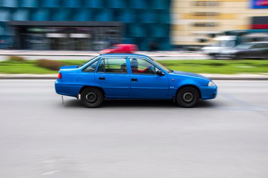 Ukraine, Kyiv - 26 April 2021: Blue Daewoo Nexia car moving on the street. Editorial