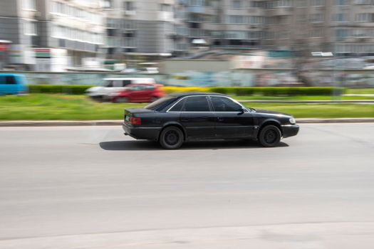 Ukraine, Kyiv - 26 April 2021: Black Audi S6 car moving on the street. Editorial