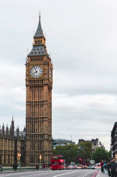 London, the Big Ben tower of the famous Palace of Westminster with urban traffic and tourists