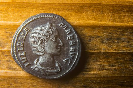 Coin of ancient Rome with a portrait of Julius Mameus close-up