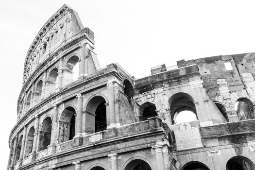 Roma, Italy, 27/11/2019: black and white photos of the ancient Colosseum of Rome photographed from below, travel reportage