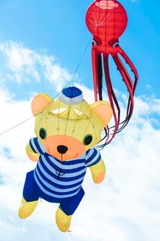 Flying kite with red Octopus-shaped and bear animal