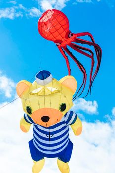 Flying kite with red Octopus-shaped and bear animal