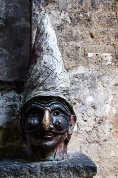 Statue with face of Pulcinella in the streets of Naples