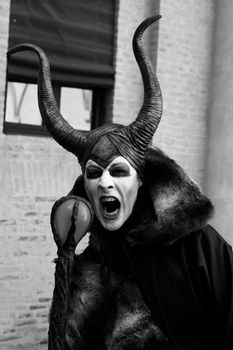 Ferrara, Italy, 19/06/2017: Funny cosplay cryng dressed as evil monster, photographed during a carnival