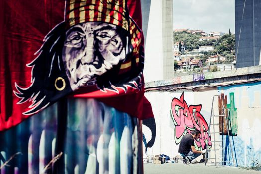 Imperia, Italy - 08/09/2018: Wall of Imperia city centre, Graffiti Artist Spray Painting Wall Art.