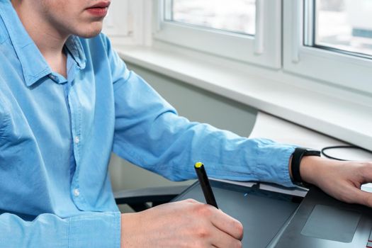designer working on a professional tablet with a pen.
