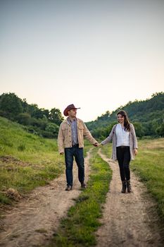 nice portrait of beautiful and young groom and bride outdoors