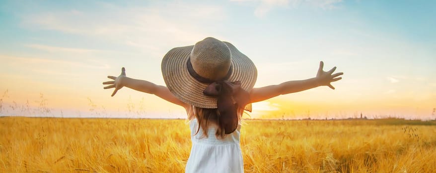 A child in a wheat field. Sunset. Selective focus. nature.