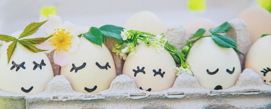 homemade eggs with beautiful faces and a smile. Selective focus. nature.