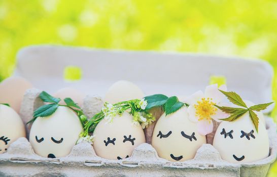 homemade eggs with beautiful faces and a smile. Selective focus. nature.