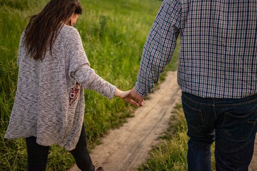 nice portrait of beautiful and young groom and bride outdoors