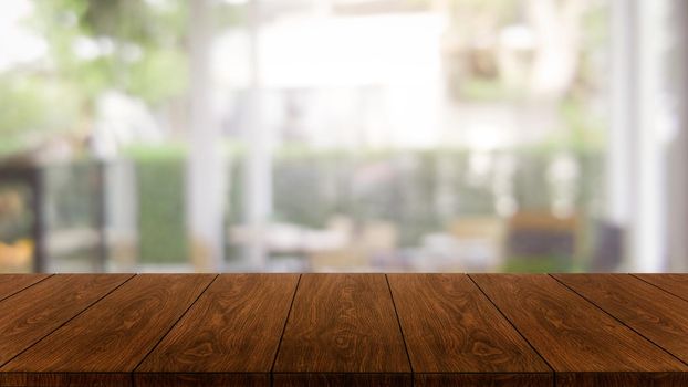 Wood table in blurry background of modern restaurant room or coffee shop with empty copy space on the table for product display mockup. Interior restaurant counter design concept.